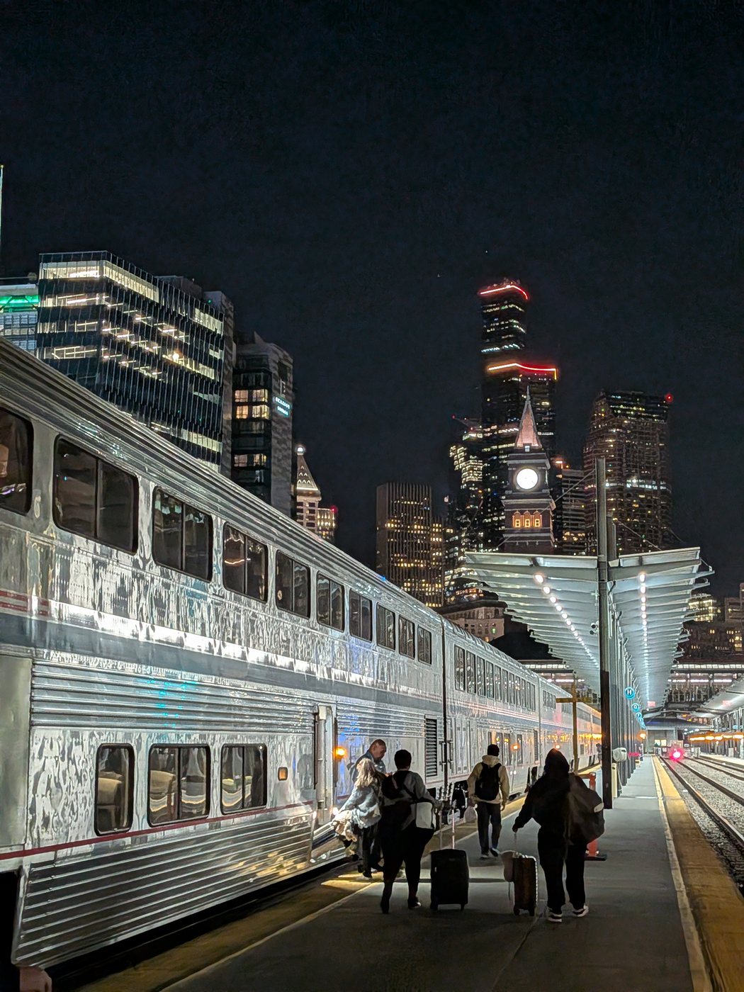 The train at the platform at night, Seattle’s towers behind it
